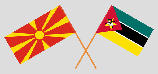Crossed flags of North Macedonia and Mozambique. Official colors. Correct proportion