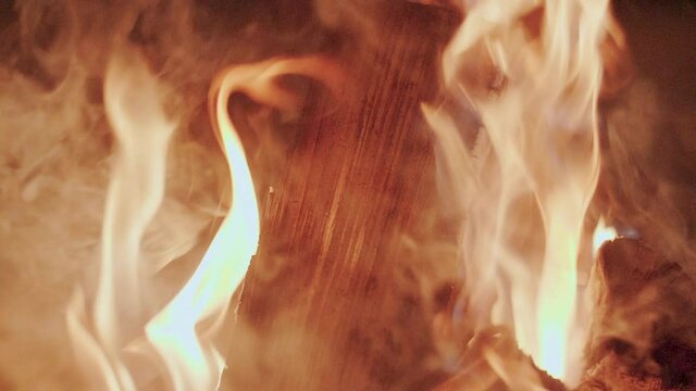 Close-Up Shot Of Warm Cozy Burning Fire In Fireplace. Slow Motion. Burning Wood.