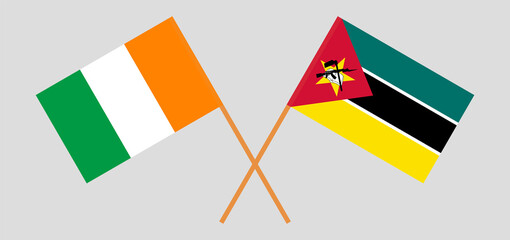 Crossed flags of Republic of Ivory Coast and Mozambique. Official colors. Correct proportion