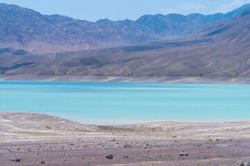 View of a mountain lake of birch color. Bartogay near the city of Almaty in Kazakhstan