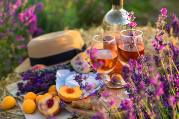 Wine in glasses. Picnic in the lavender field. Selective focus.