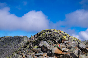 the summit of the Gaustatoppen in norway with  a stony path that few dare to climb
