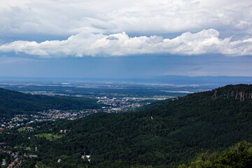 Fototapeta na wymiar View in summer over Baden-Baden under cloudy skies, Black Forest, Germany