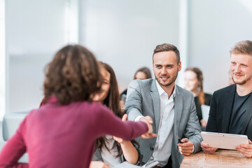 Fototapeta premium close up. young people shaking hands at an office meeting