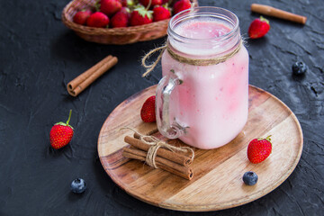 Healthy smoothie of fresh summer berries. Creative atmospheric decoration