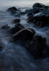 Rocks and flowing waves along the shoreline of Camiguin Island