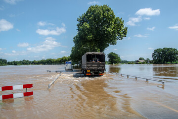 Flood conditions in the province Limburg, streets full of water, residents evacuate, Netherlands,...
