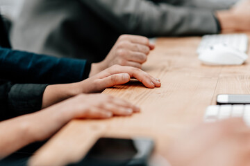 close up. image of a group of employees sitting at a table