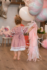 Children's birthday. Happy child with balloons