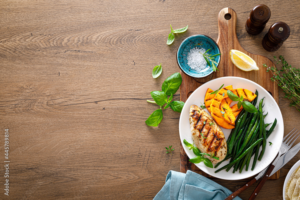 Canvas Prints Grilled chicken breast with green beans and butternut squash, top view