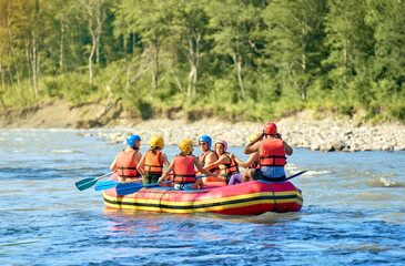 rafting on a large boat on a mountain river