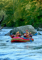 rafting on a large boat on a mountain river - obrazy, fototapety, plakaty