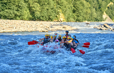 rafting on a large boat on a mountain river