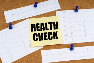 Attached to the board are cardiogram clippings and a sticker with the inscription - HEALTH CHECK