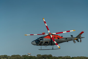 A helicopter for rescue and transportation operations, military production, flies in the sky over...