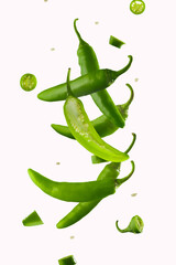 Jalapeno Pepper Levitation. White background. Hot spice, seasoning. Levitation. Lots of facilities. Abstraction. Background. Texture. There are no people in the photo. Color image. - 445792817