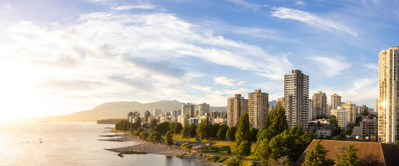 Fototapeta premium Aerial Panoramic View of Modern City with a beach on the West Coast Pacific Ocean. Sunny Summer Sunset. False Creek, Downtown Vancouver, British Columbia, Canada.