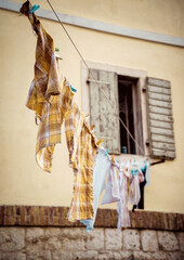 Hanging Clothes on the rope with clothespins