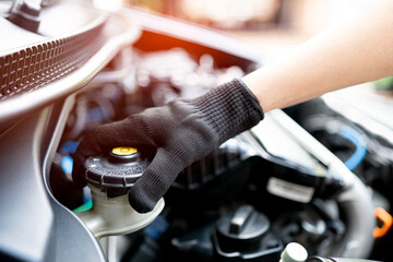 Hand of Technician checking brake fluid  in engine room maintenance and basic service concept of the car and brake system - obrazy, fototapety, plakaty