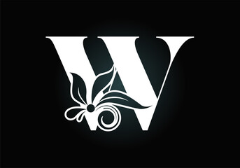 Floral monogram letter W. Initial alphabet with botanical elements. Font emblem. Vector illustration for wedding invitations, greeting cards, logos, posters, and other designs.