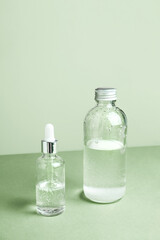 Dropper glass Bottle Mock-Up. Body treatment and spa. Natural beauty products. Eco cream, serum, skin care blank bottle. Anti-cellulite massage oil. Oily cosmetic pipette