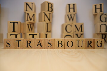 The word Strasbourg was created from wooden letter cubes. Cities and words.