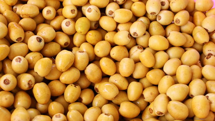 Fresh yellow dates fruit background. Barhee or Barhi palm (Phoenix dactyifera L.) is a healthy...