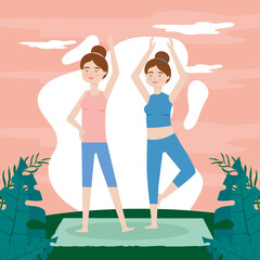 women practice yoga outdoors
