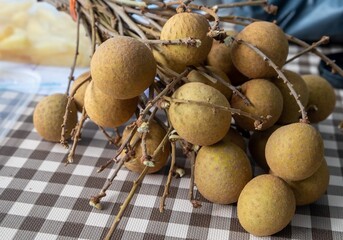 Close up, ripe longan, ready to eat on the dining table, taste
