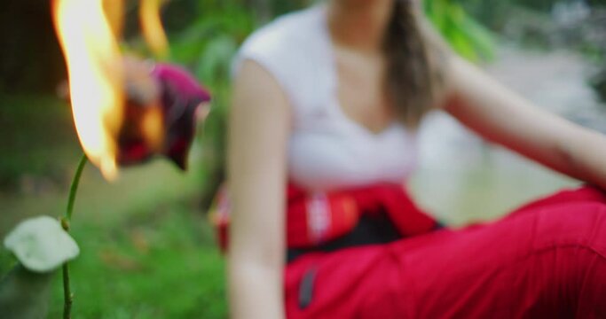 Woman Stares At A Burning Rose in Kuala Lumpur, Malaysia