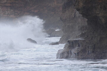 waves crashing on rocks