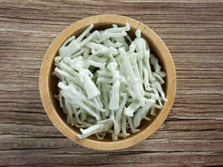 The white business man figure in wood bowl for business background concept