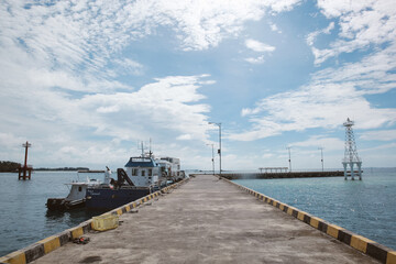 A ship floating on a harbor with beautiful sky background, Karimun Jawa