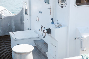 Metal ferry boat driving controls © Gatot