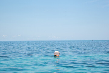 A sea barier ball floating on the ocean