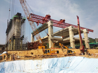 PENANG, MALAYSIA -MAY 3, 2020: Structural work is underway at the construction site. Work is carried out in stages according to the sequence of work. The workers practice standard safety methods.