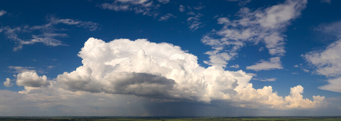 Panorama, cloudy sky at sunset. Pink clouds.