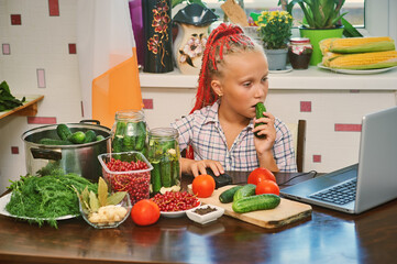 The child is engaged in canning vegetables at home. Procurement of products.