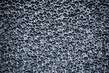 Black foam texture. Grey styrofoam material or white plastic polystyrene pattern. Gray wall for...