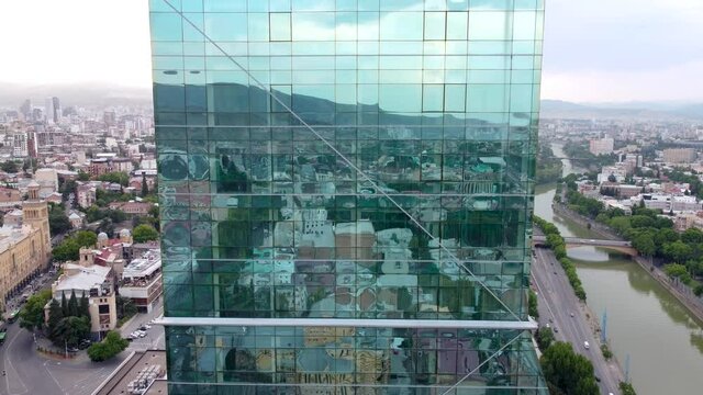 ity reflections in the glass skyscraper