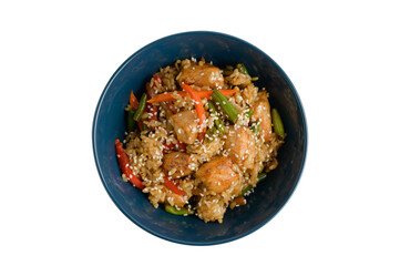 serving of fried chiken with rise and vegetable on deep blue dish on white isolated background with copyspace