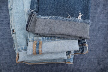 Close up of rolled up cuffs of denim jeans