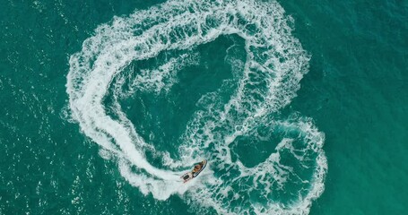Epic jet ski ride, adventurous young couple playing on jet ski in tropical blue ocean, vacation adventure lifestyle