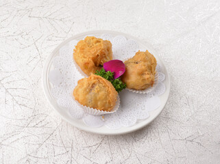 deep fried crispy mini pastry ball with red bean, banana, yam, durian inside asian Hong Kong dim...