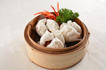 chinese steamed sweet char siew pork meat bao bun bread in bamboo basket asian pastry Hong Kong dim sum menu