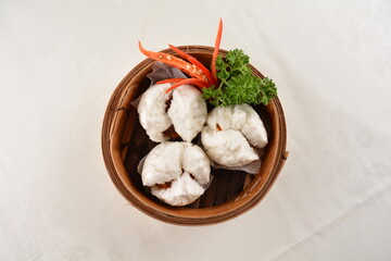 chinese steamed sweet char siew pork meat bao bun bread in bamboo basket asian pastry Hong Kong dim...
