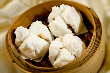 chinese steamed sweet char siew pork meat bao bun bread in bamboo basket asian pastry Hong Kong dim sum menu