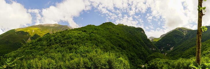 Fototapeta na wymiar Gran sasso mountains panoramic view on a cloudy trekking day, Abruzzo, Italy