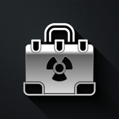 Silver Radiation nuclear suitcase icon isolated on black background. Long shadow style. Vector