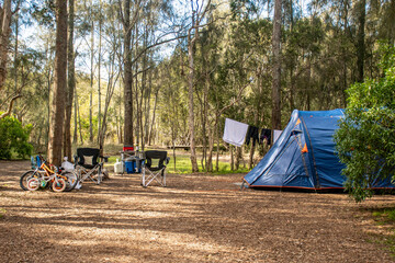 Family tent setup at the campsite surrounding by nature in holiday park